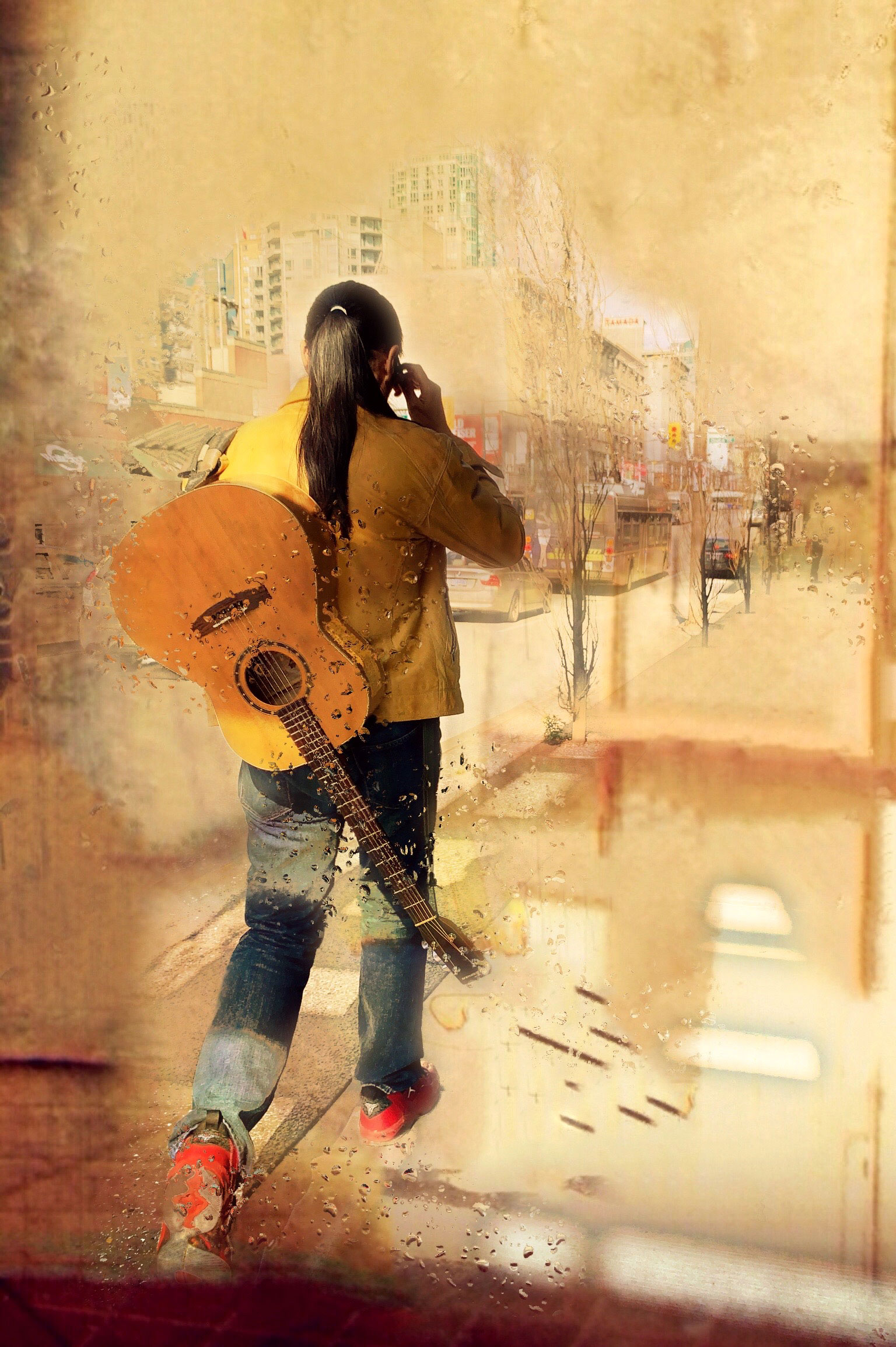 man walking away with guitar